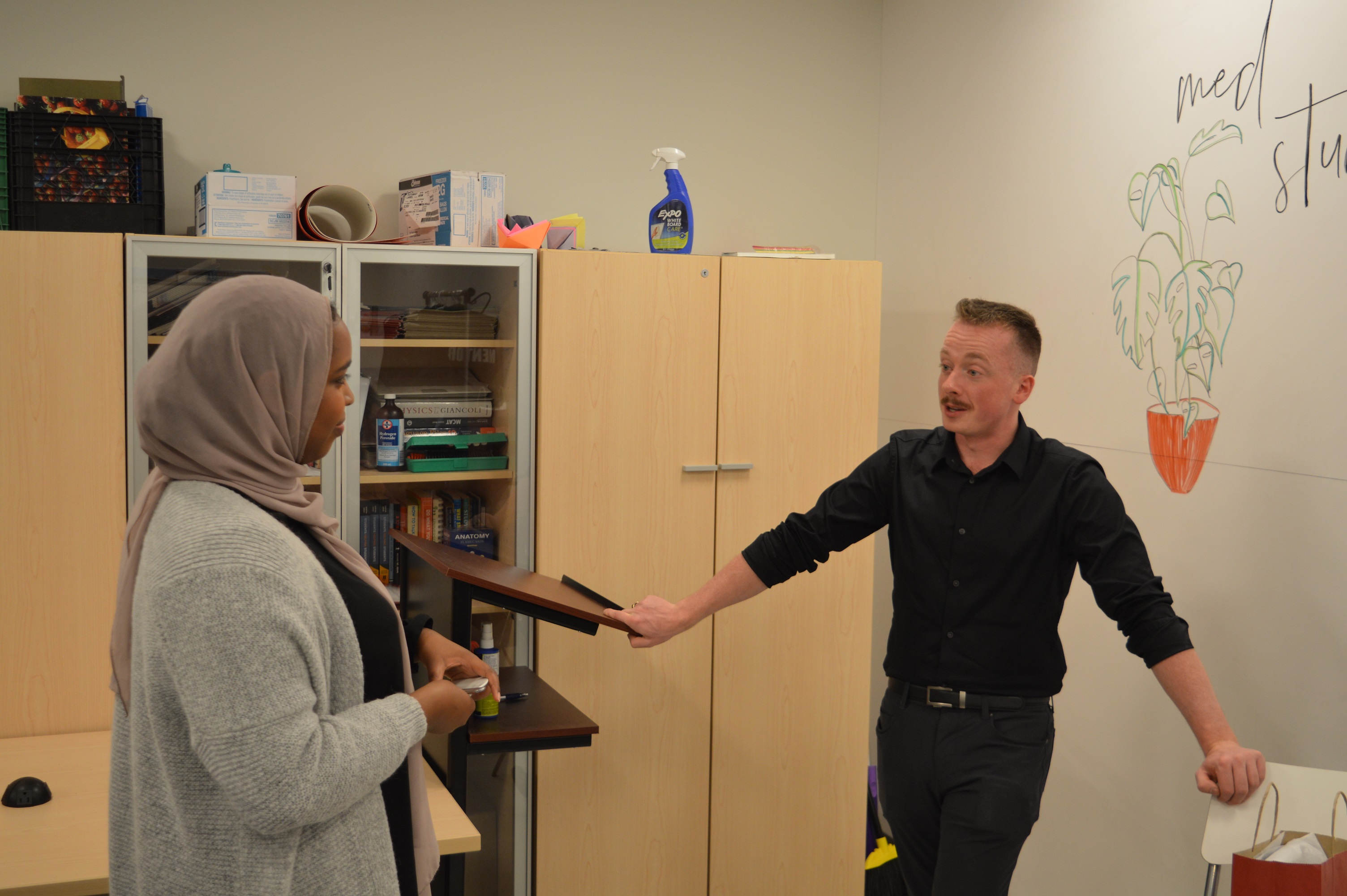 a student interacting one on one with a current med student